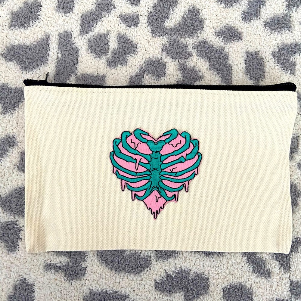 HANDMADE COSMETICS BAG WITH RIBCAGE PATCH
